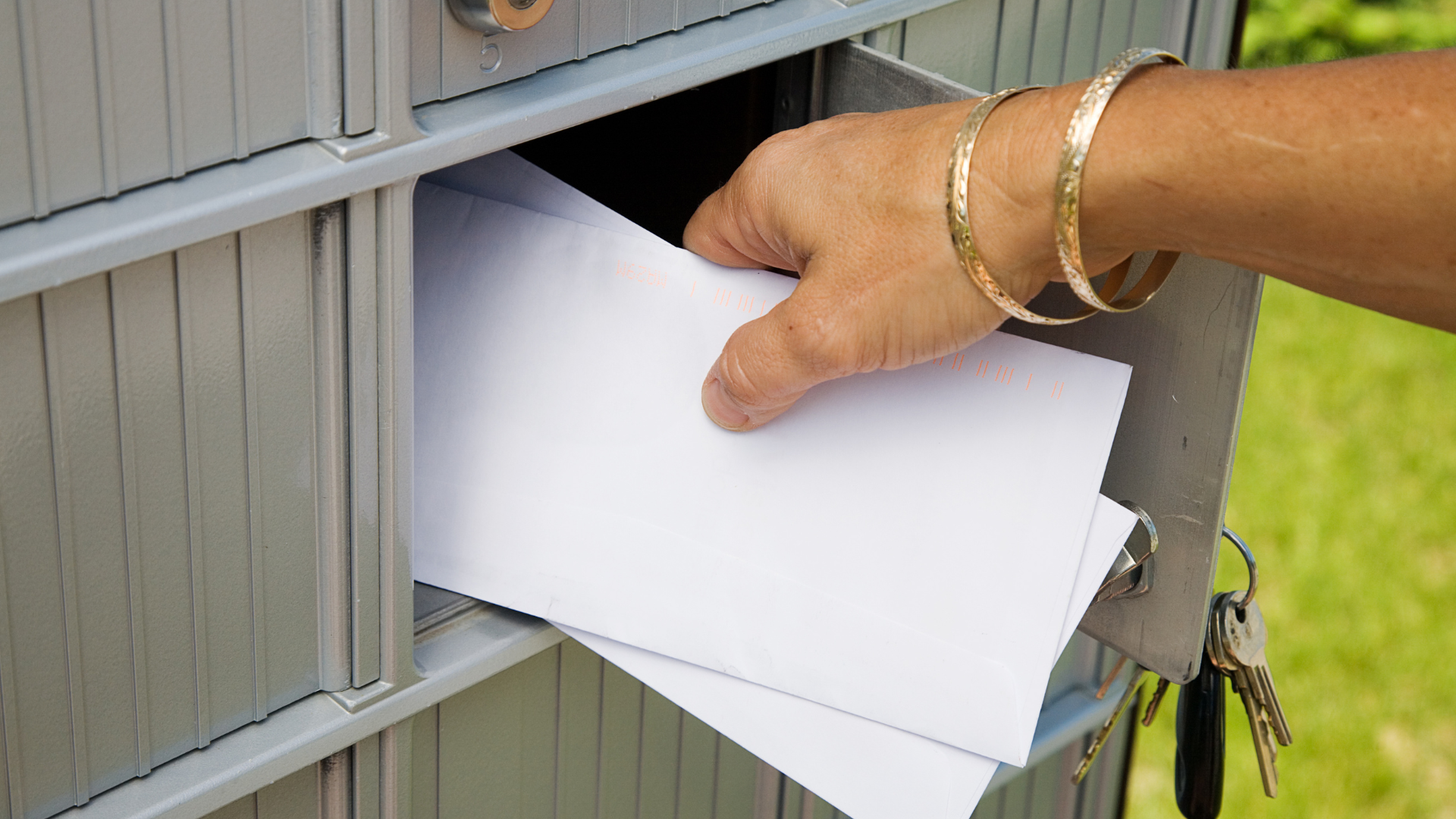 Direct Mail person getting the mail from the mailbox